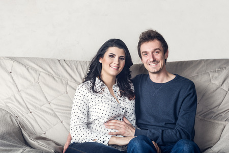 Pregnant mother and happy fatherの写真素材