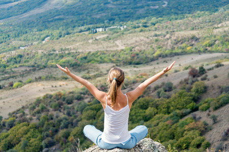 Woman Meditate at the Mountainsの写真素材