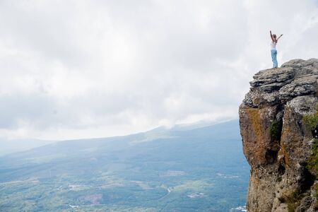 Woman on the top at Mountainsの写真素材