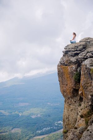 Woman Meditate at the Mountainsの写真素材
