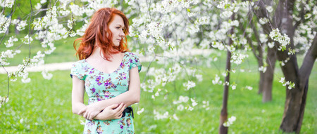 Beautiful portrait of woman in the gardenの写真素材