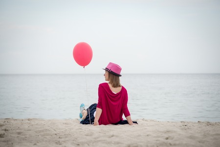 Happy girl holding air balloonの写真素材