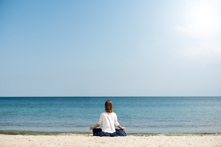 serenity and yoga practicing at the seaの写真素材