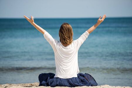 serenity and yoga practicing at the seaの写真素材