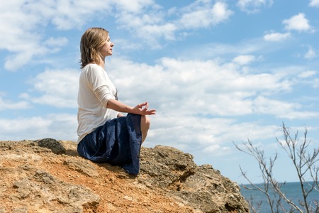 serenity and yoga practicing at the seaの写真素材