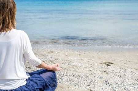 serenity and yoga practicing at the seaの写真素材