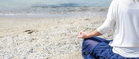 serenity and yoga practicing at the seaの写真素材