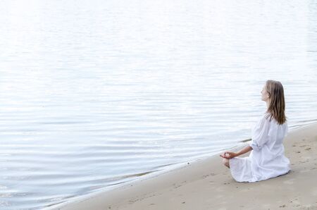 serenity and yoga practicing at the seaの写真素材