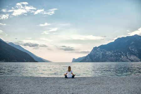 serenity and yoga practicing at the lake Gardaの写真素材