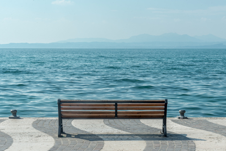 shore of Lake Garda with Alps mountain, Italyの写真素材