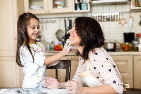 Mother and daughter cookingの写真素材