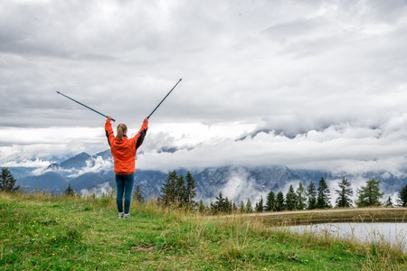 Young woman without backpack hiking in the mountains Alps. Austria. Insbrukの写真素材