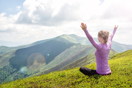 Young woman on the top of mountainの写真素材