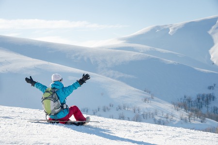 Young woman with snowboardの写真素材