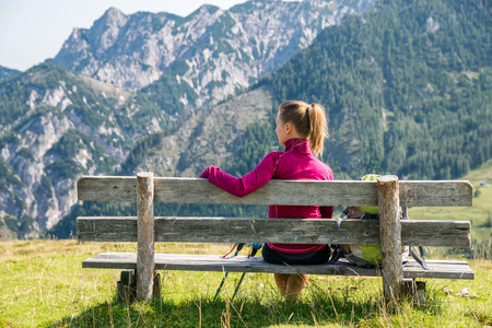 Young woman hiking in the mountainsの写真素材