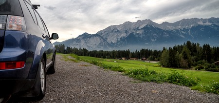 car for traveling with a mountain roadの写真素材