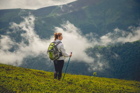 Young woman hiking in the mountains