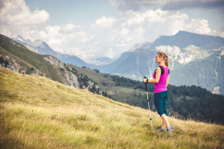 Young woman hiking in the mountainsの写真素材