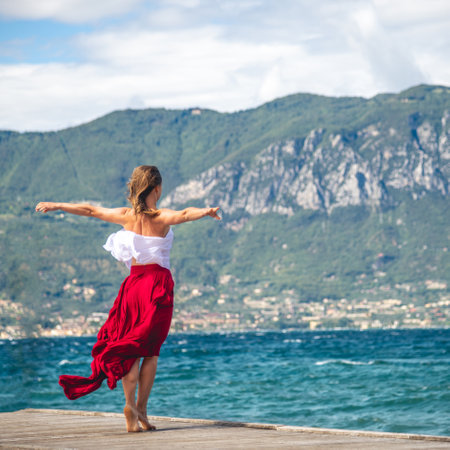 Woman walking on a pierの写真素材