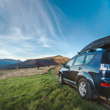 car for traveling with a mountain roadの写真素材