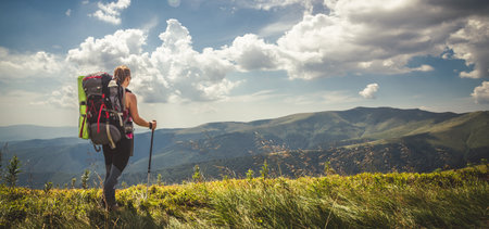 Young woman n the top of the mountains