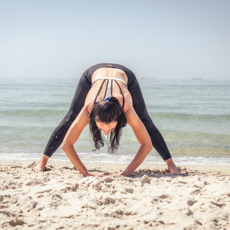 Fitness Girl working out on the beachの写真素材