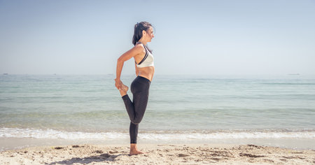 Fitness Girl working out on the beach