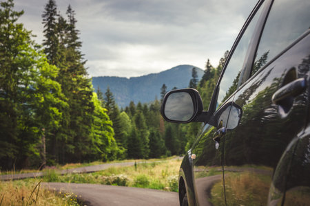 Car on the road in the Carpathian Mountains, Ukraine.の写真素材