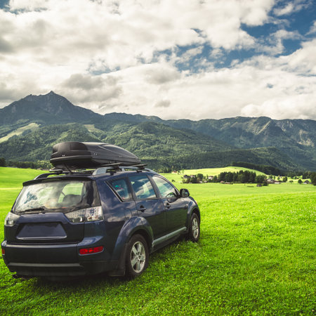 car for traveling with a mountain roadの写真素材