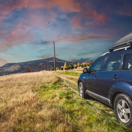 car for traveling with a mountain roadの写真素材