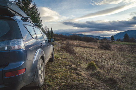 car for traveling with a mountain roadの写真素材