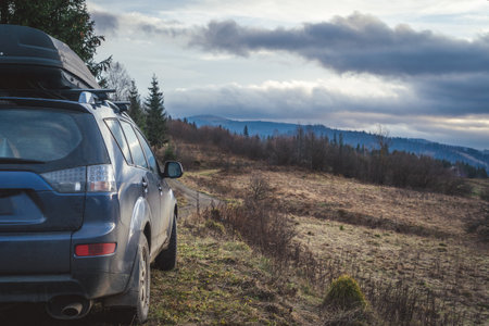 car for traveling with a mountain roadの写真素材
