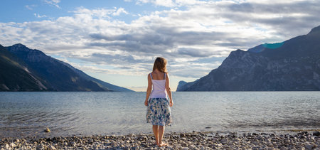 Woman standing at the lake Garda. Italyの写真素材