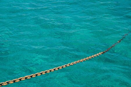 Chain on the background of the seaの写真素材