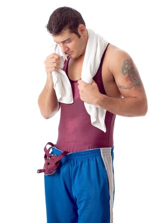 Young adult male wrestler. Studio shot over white.の写真素材