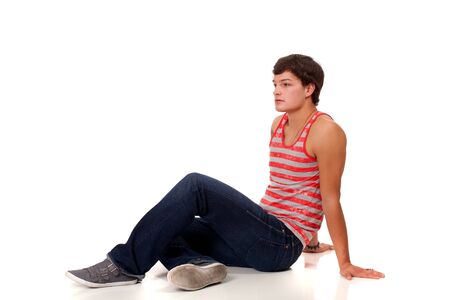 Young man in red and white striped shirt and jeans.の写真素材