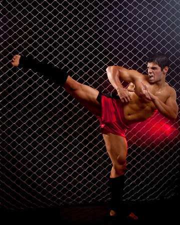 Mixed martial artist posed in front of chain linkの写真素材