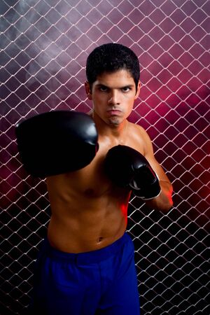 Mixed martial artist posed in front of chain linkの写真素材