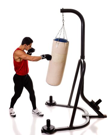 Boxing heavy bag workout. Studio shot over white.の写真素材