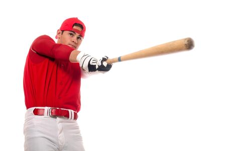 Baseball player with bat. Studio shot over white.の写真素材