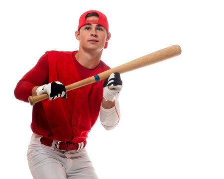 Baseball player with bat. Studio shot over white.の写真素材