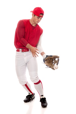 Baseball player fielding. Studio shot over white.の写真素材