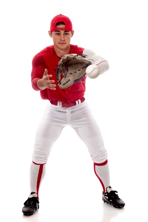 Baseball player fielding. Studio shot over white.の写真素材