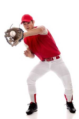 Baseball player fielding. Studio shot over white.の写真素材