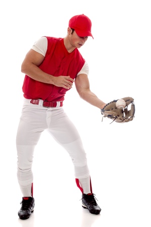 Baseball player fielding. Studio shot over white.の写真素材