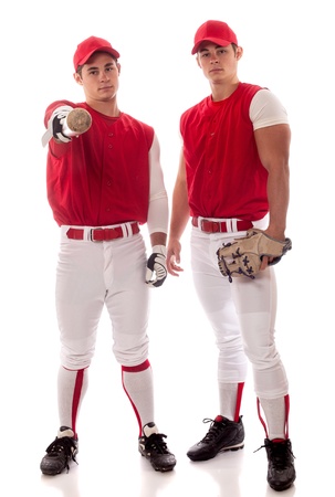 Two baseball teammates. Studio shot over white.の写真素材