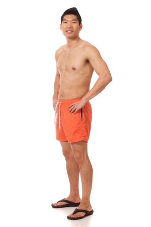 Young man in swimwear. Studio shot over white.の写真素材