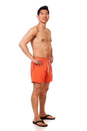Young man in swimwear. Studio shot over white.の写真素材