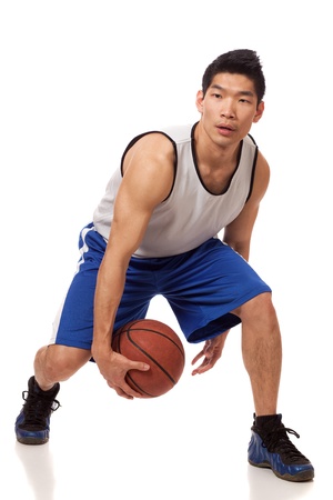 Male basketball player. Studio shot over white.の写真素材