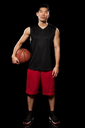 Male basketball player. Studio shot over black.の写真素材